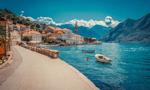 Harbour and boats in sunny day at Boka Kotor bay, Montenegro, Europe