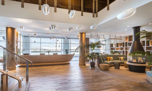 Hilton Auckland front desk with fireplace, New Zealand