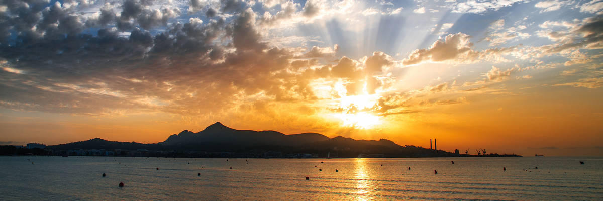 Majorca Puerto de Alcudia beach pier at sunrise in Alcudia bay in Mallorca Balearic islands of Spain