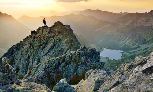 Man on hill at sunrise