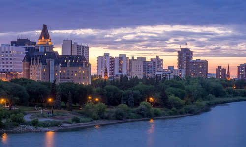 Saskatoon skyline at night along the Saskatchewan River