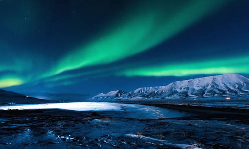 The polar Northern lights in Norway Svalbard in the mountains