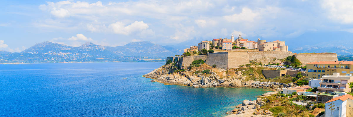 View of citadel with houses in Calvi bay, Corsica island, France