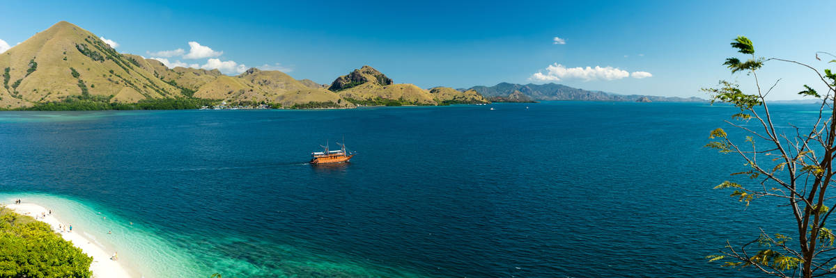 View over white sand beach and coral bay at Komodo, Flores Indonesia