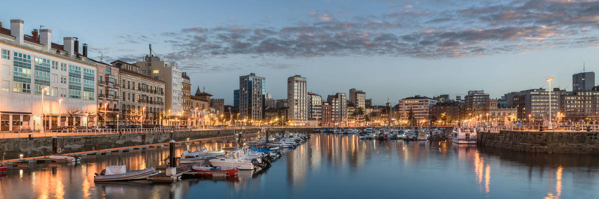 Yachts and pier in leisure port on maritime fishing district of Gijon, Spain