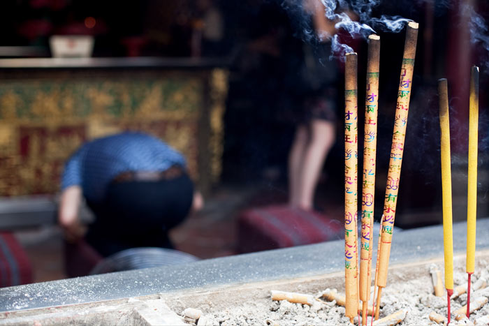 Pausing for prayer at A-Ma Temple, Macau